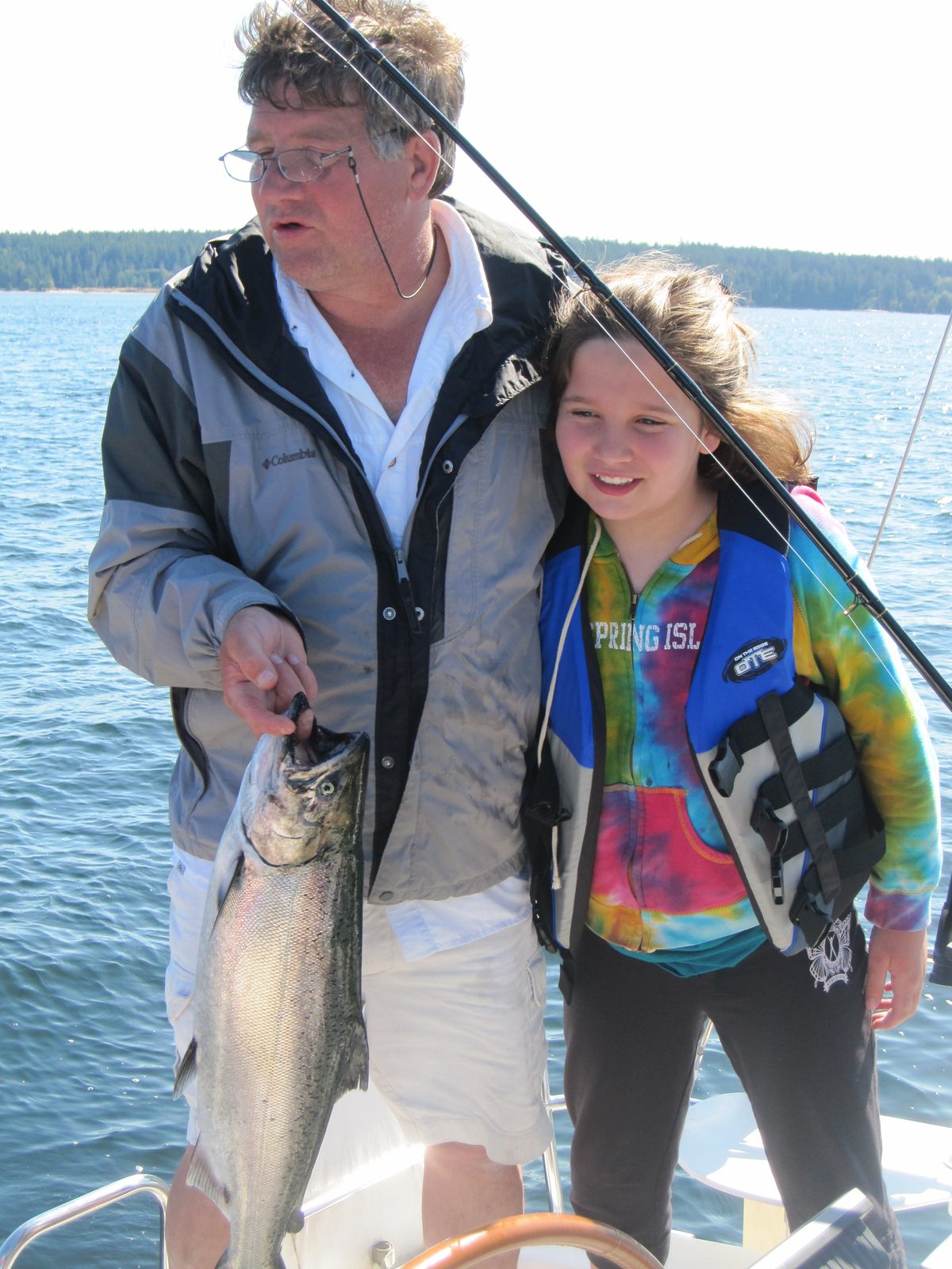 Todd and his granddaughter Jacq with a salmon on the boat